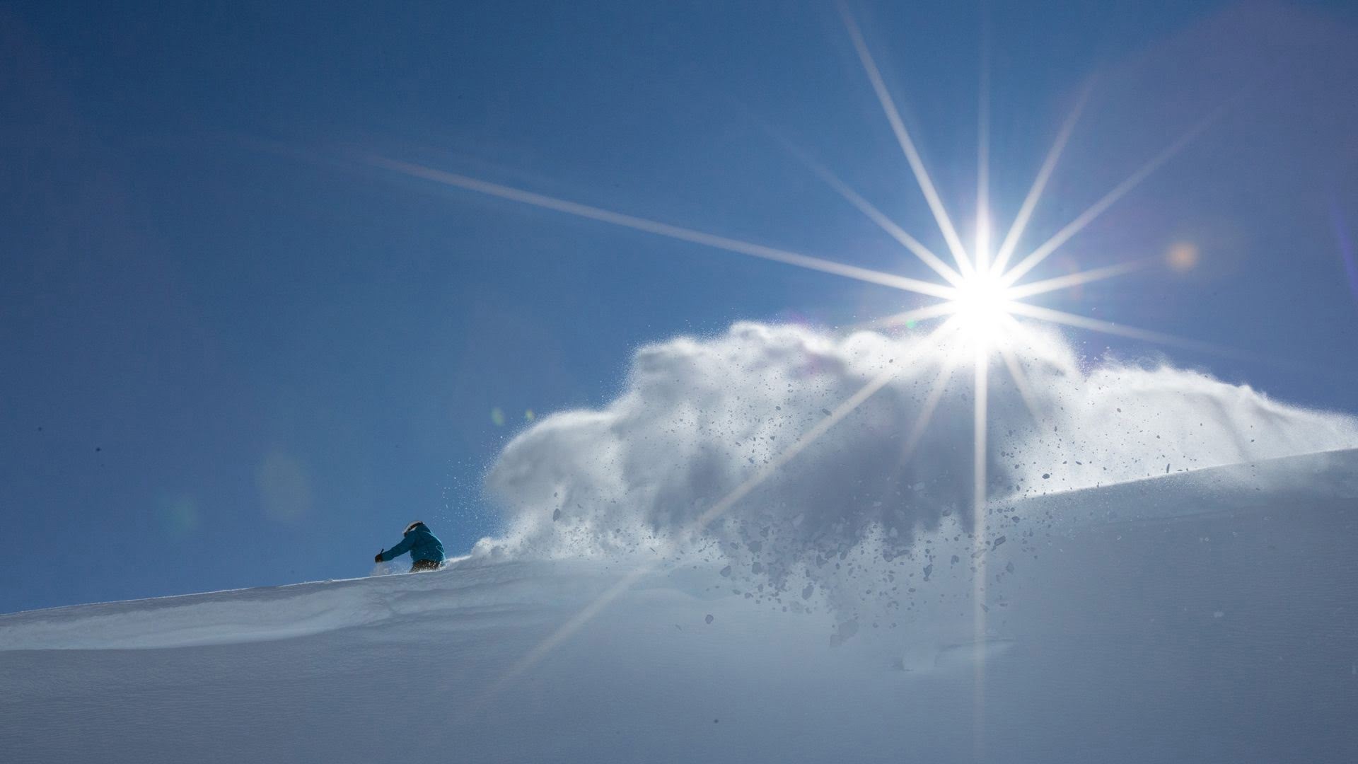 A skier sprays a flume of snow at Tūroa Ski Resort - Visit Ruapehu.jpg