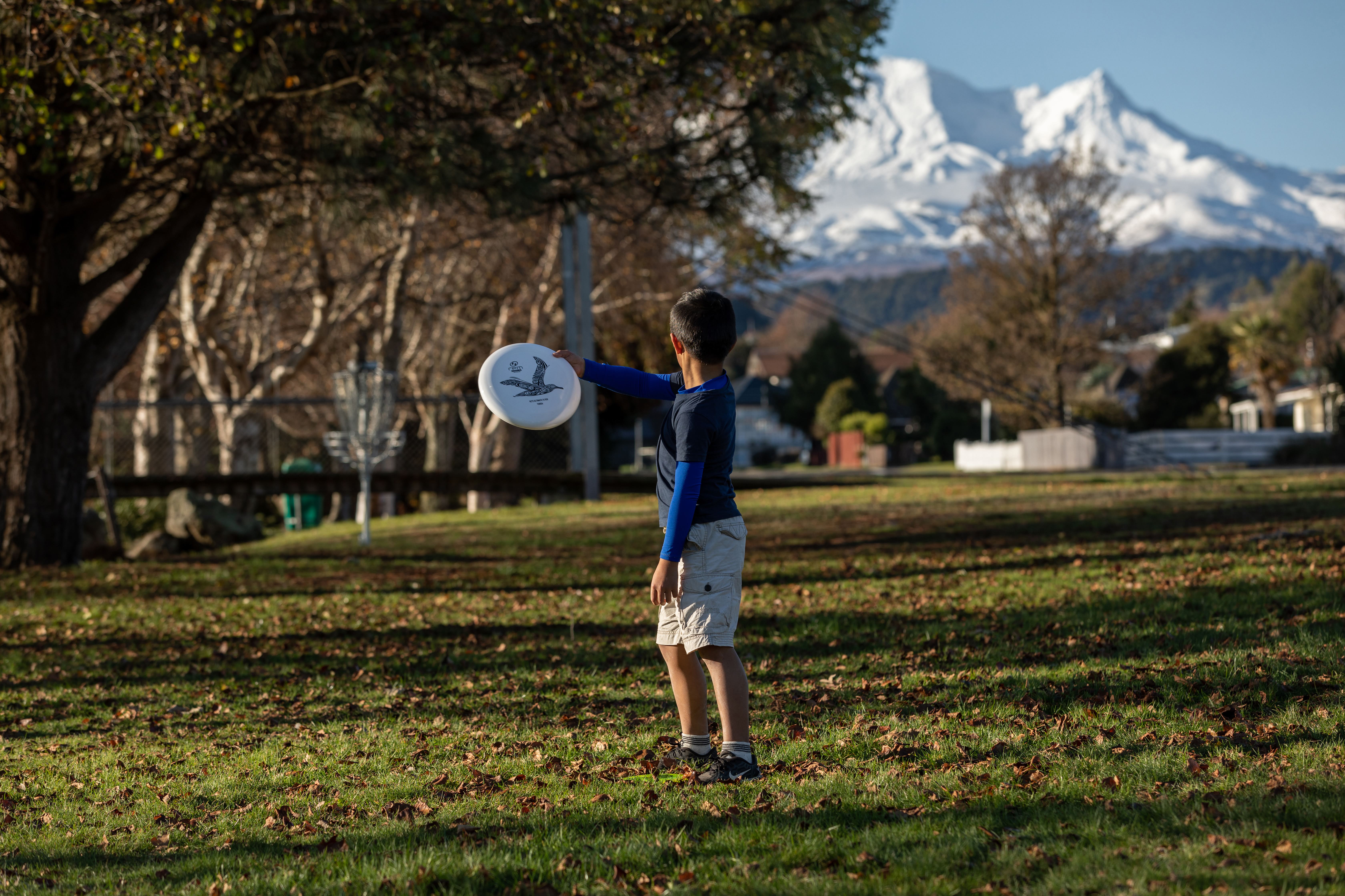 Child playing disc golf at the Mangawhero Terrace course.jpg