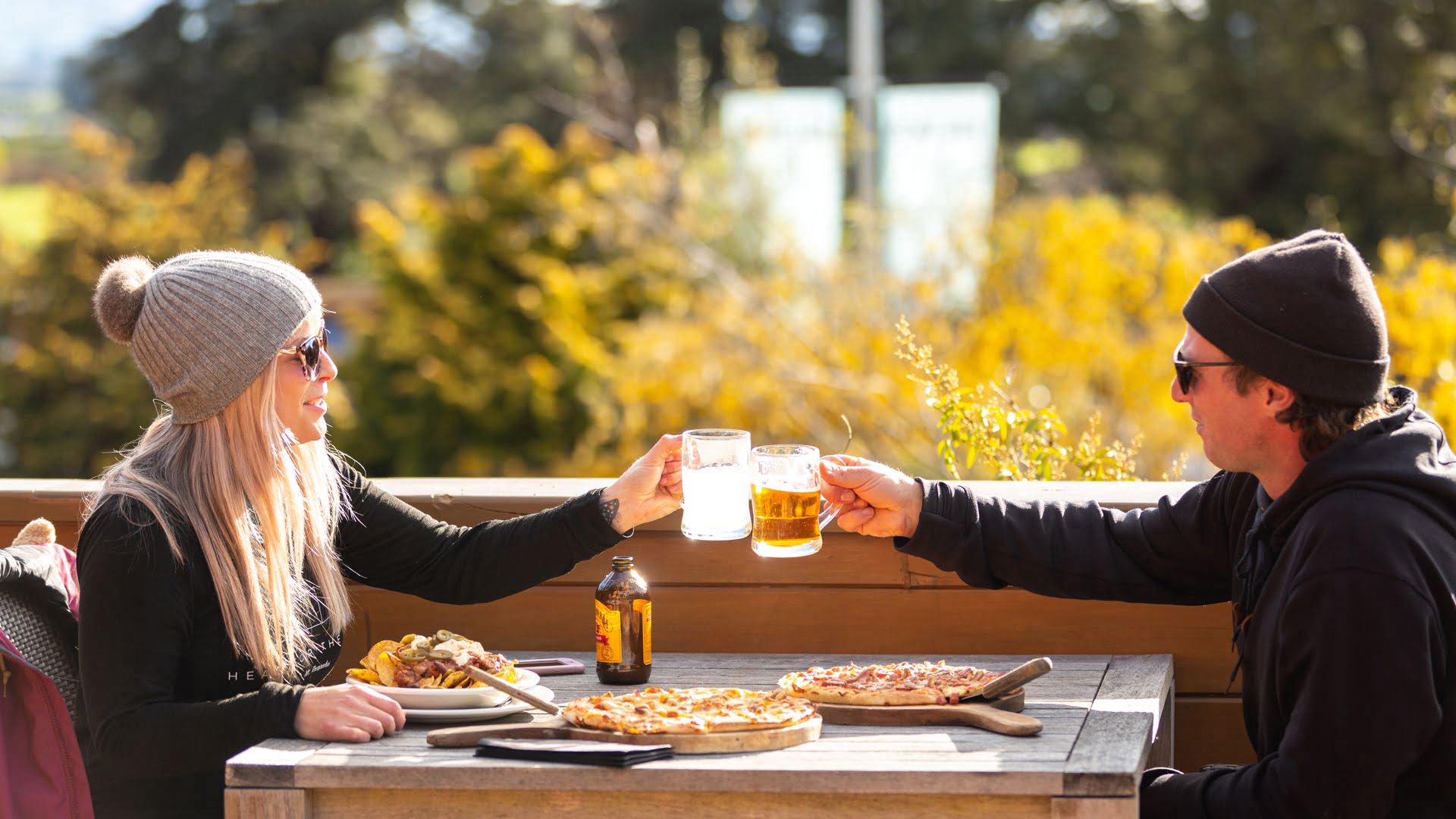 Couple enjoying pizza at Powderhorn Chateau in Ohakune in winter - Visit Ruapehu.jpg