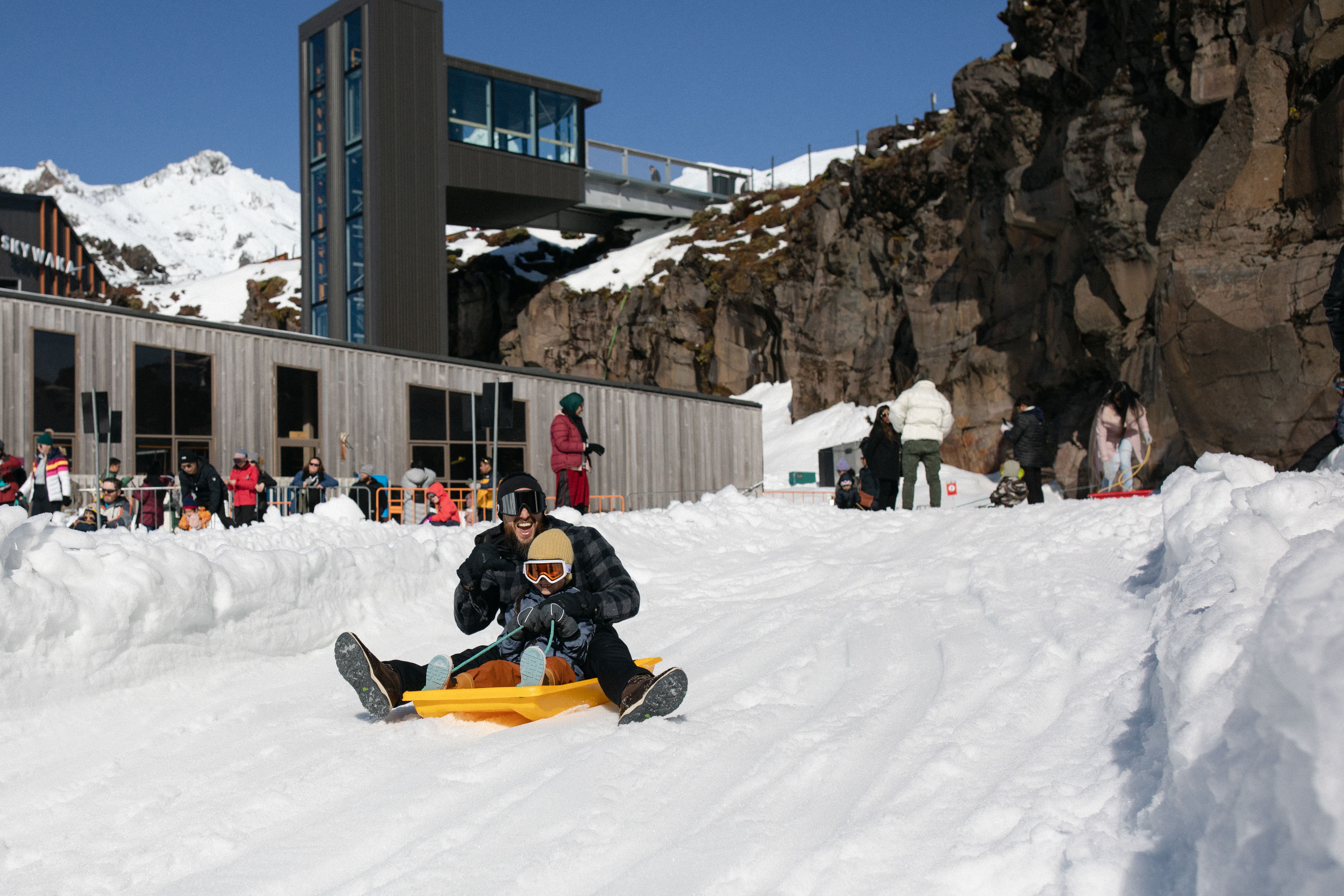 Father and Son Sledding at Happy Valley - Visit Ruapehu