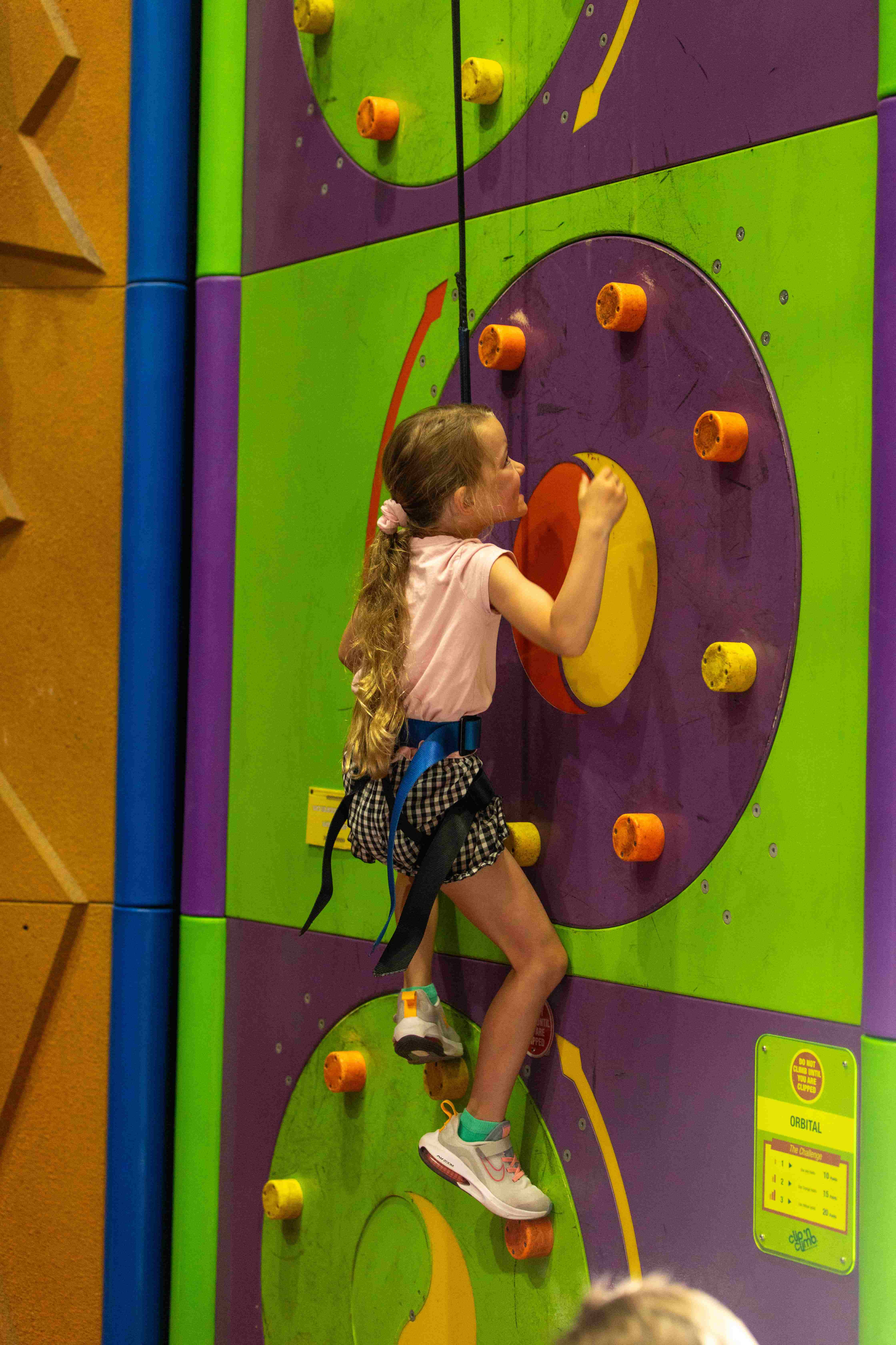 Girl Climing at Vertigo Climbing.jpg